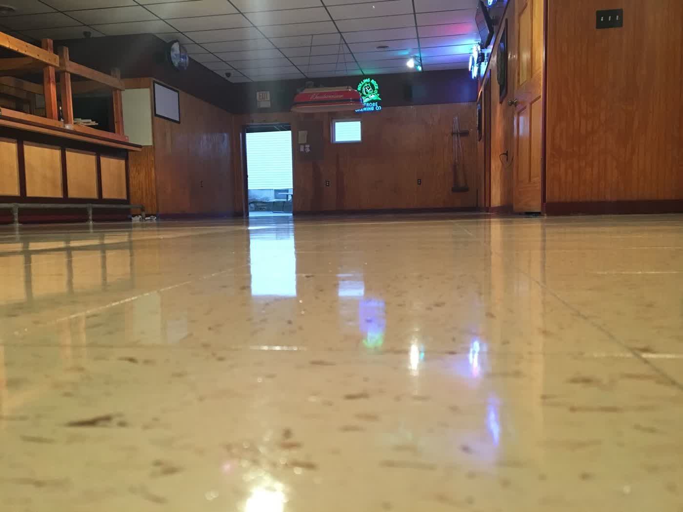 Same class of commercial VCT after Contro finish — mirror gloss