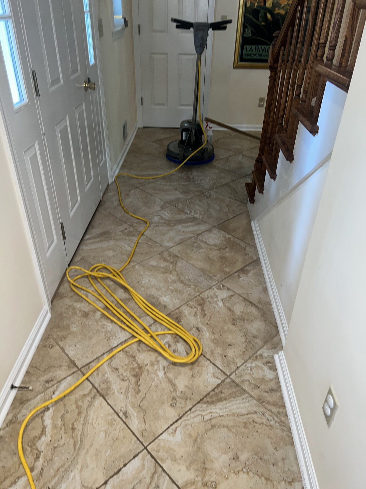 Floor buffer equipment on tile foyer